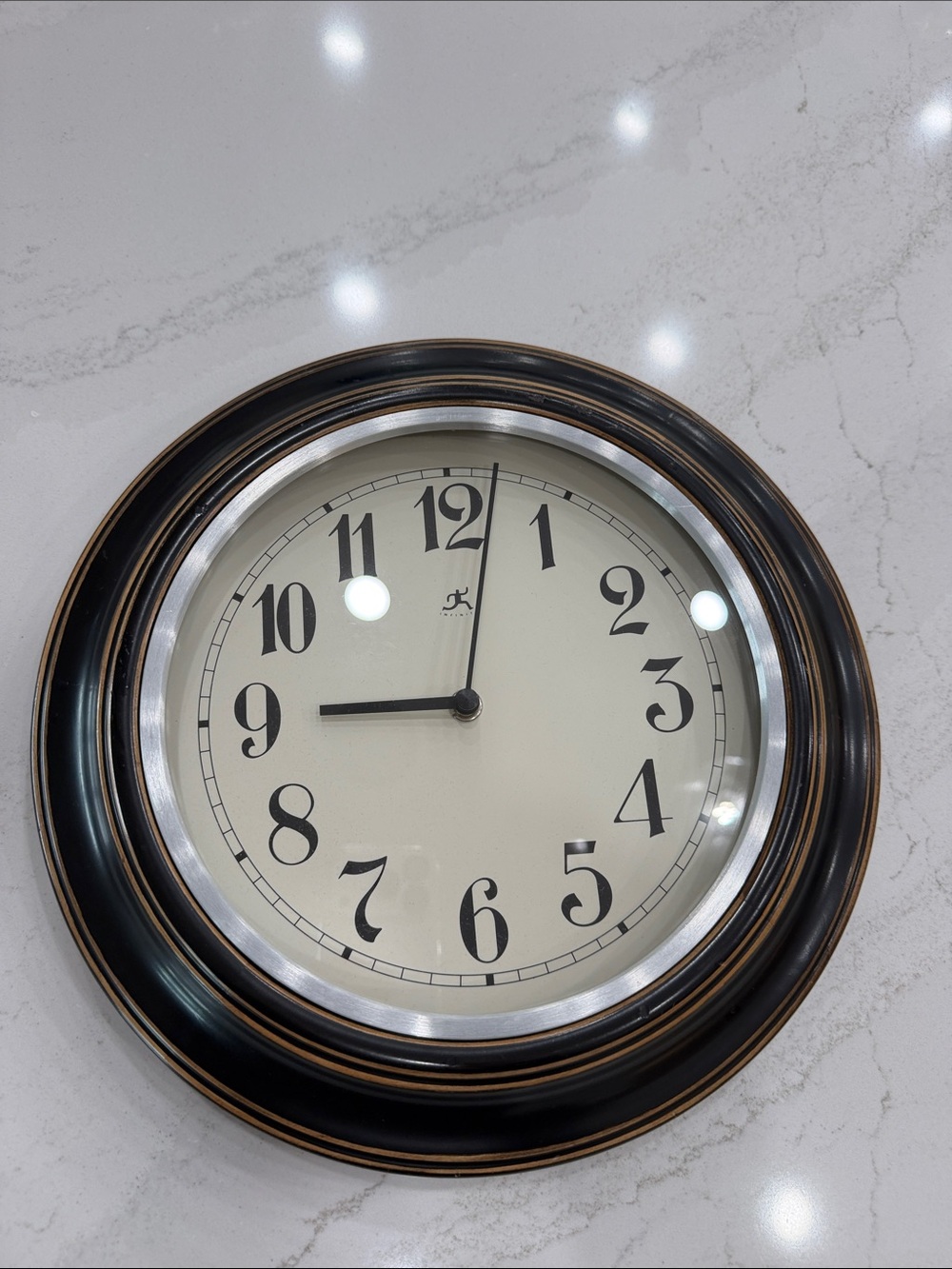 Classic Black Wall Clock with Antique Bronze Accents